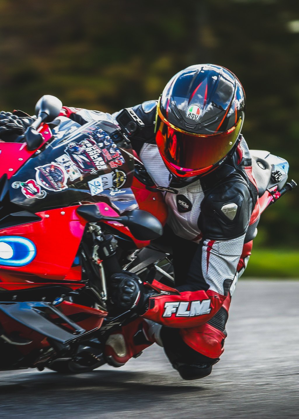 Rider on a red BMW leaned deep into a corner