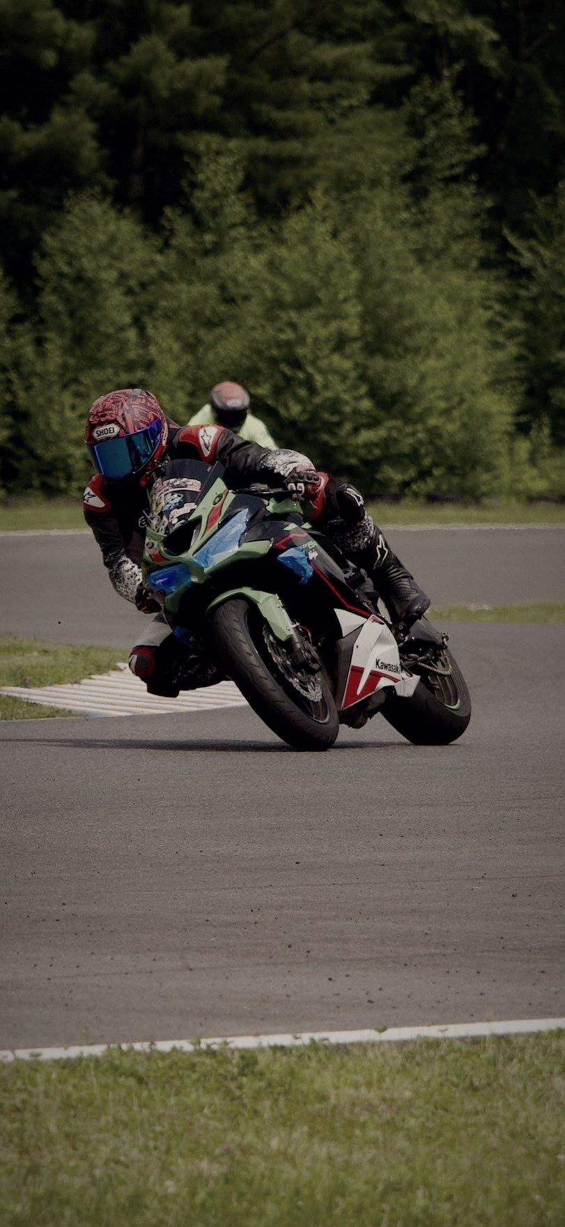 Trackheads rider on the green Kawasaki at NY Raceport