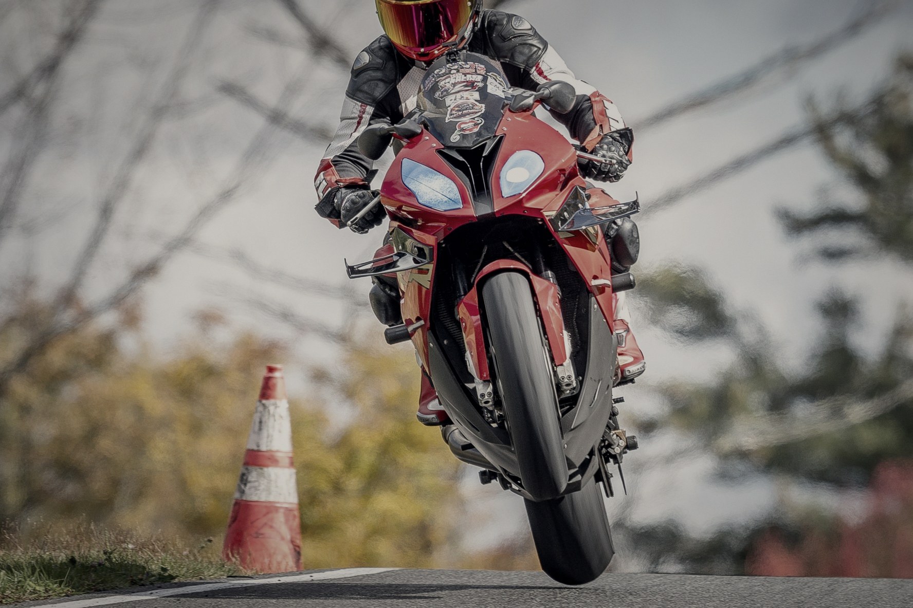 Rider lifting the front wheel over a crest at NY Raceport, photographed by Peter Levins